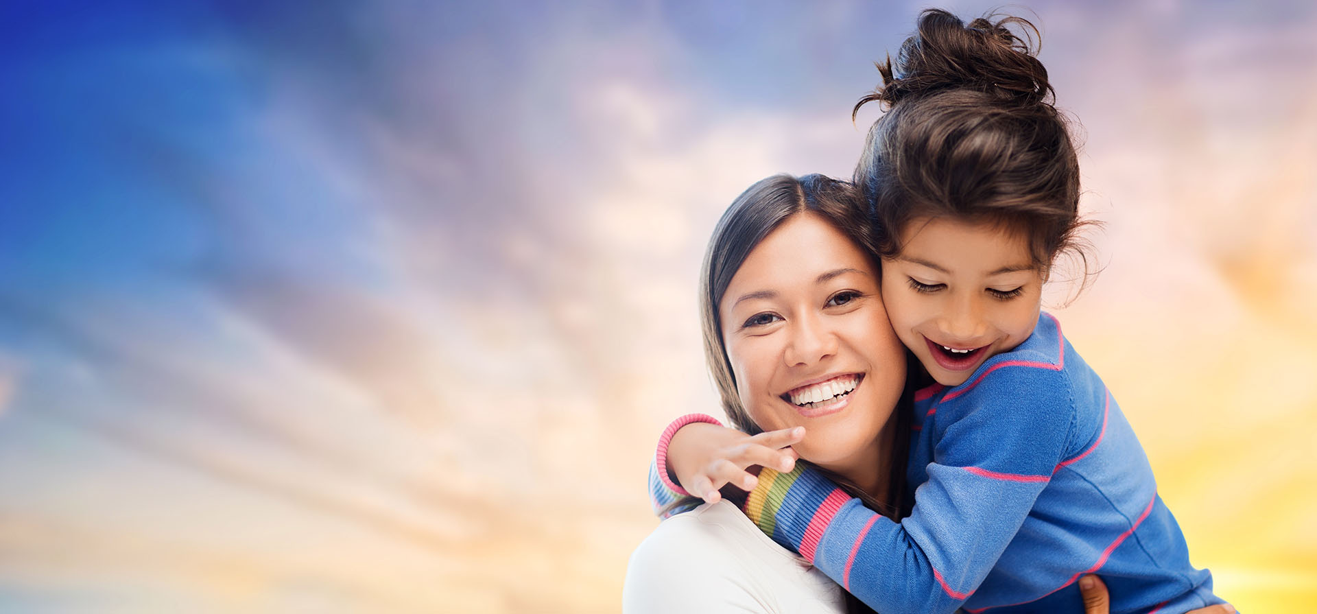 child hugging smiling woman