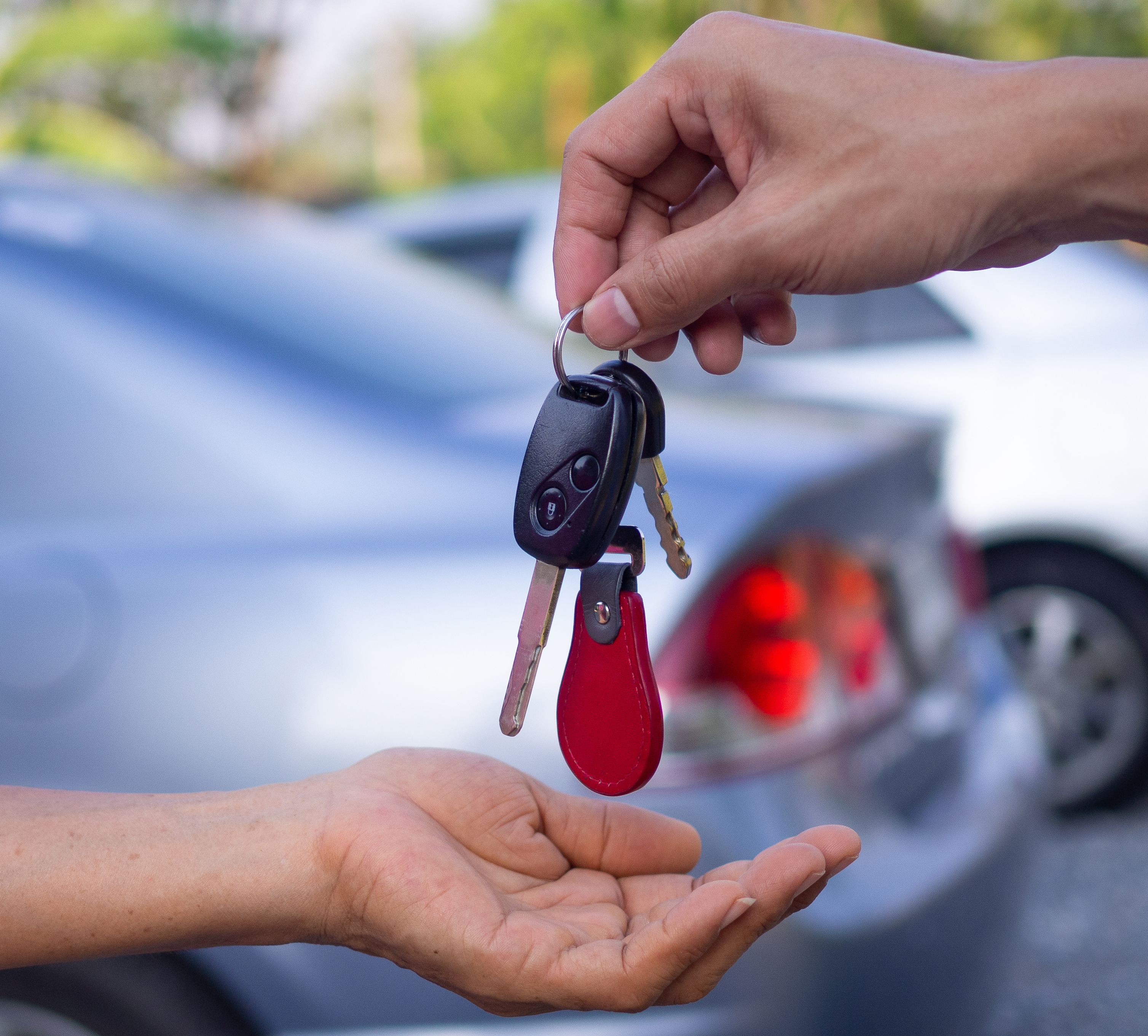 hand with car keys